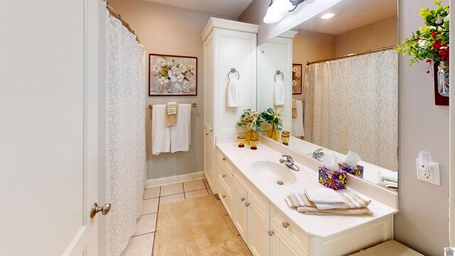 bathroom featuring tile patterned flooring and vanity