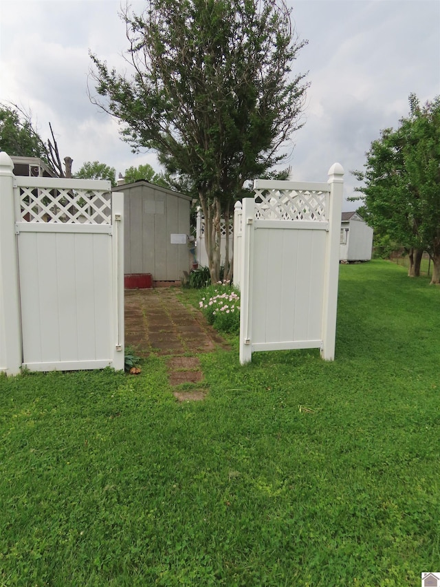 view of yard featuring a gate and fence