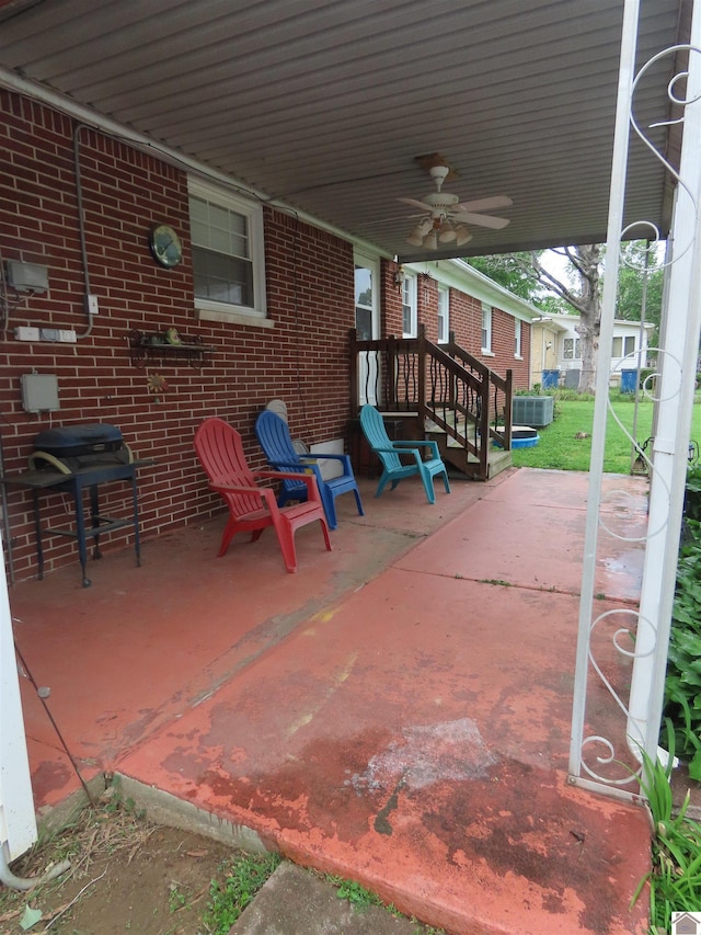 view of patio / terrace with ceiling fan and a grill