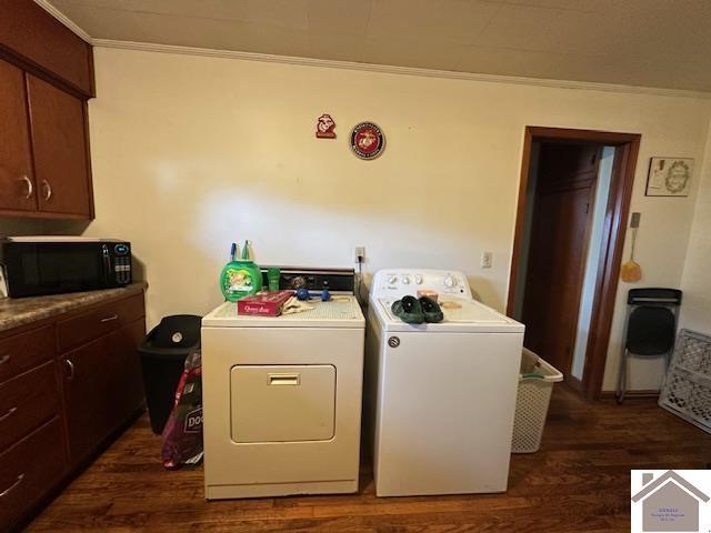 washroom with ornamental molding, laundry area, dark wood-style flooring, and washer and dryer