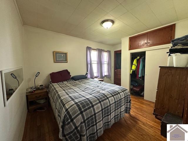 bedroom with a closet and wood finished floors