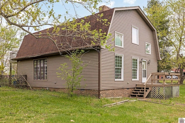 back of house with a wooden deck, a gambrel roof, a shingled roof, crawl space, and a yard