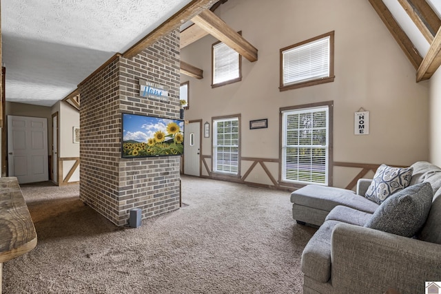 living room featuring a textured ceiling, carpet flooring, high vaulted ceiling, and beam ceiling