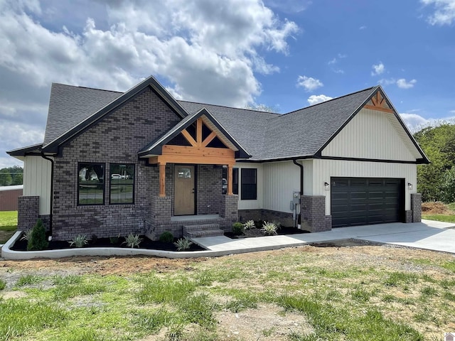 1360 Eagle Ln, Mayfield, KY 42066 - view of front facade with roof with shingles, brick siding, board and batten siding, concrete driveway, and an attached garage