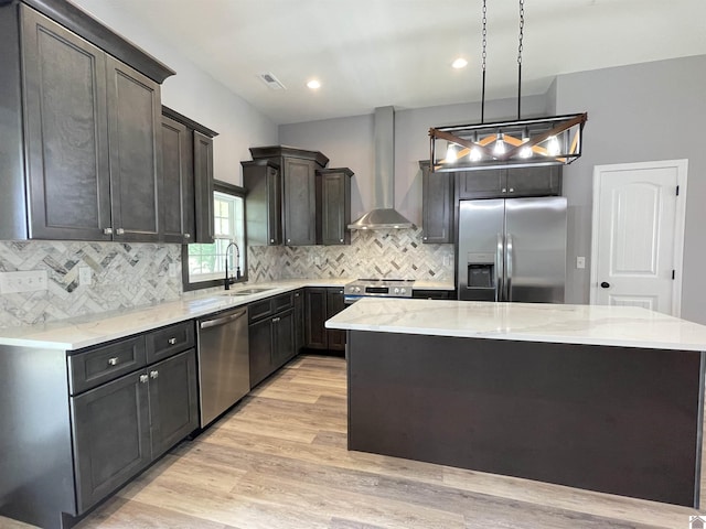 1360 Eagle Ln, Mayfield, KY 42066 - kitchen featuring visible vents, a center island, wall chimney exhaust hood, a sink, and appliances with stainless steel finishes