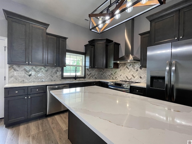 1360 Eagle Ln, Mayfield, KY 42066 - kitchen with light stone counters, a sink, wall chimney exhaust hood, stainless steel appliances, and light wood-type flooring