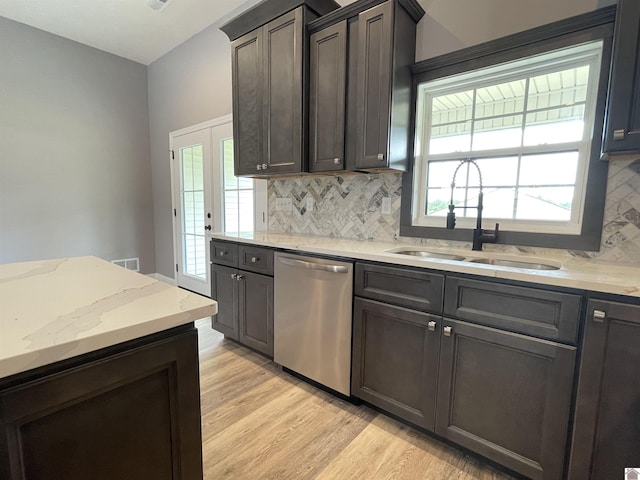 1360 Eagle Ln, Mayfield, KY 42066 - kitchen featuring light stone countertops, a sink, decorative backsplash, light wood-type flooring, and stainless steel dishwasher