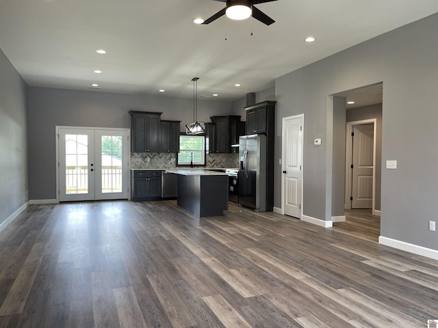 1360 Eagle Ln, Mayfield, KY 42066 - kitchen with a center island, light countertops, dark wood-type flooring, a ceiling fan, and stainless steel appliances