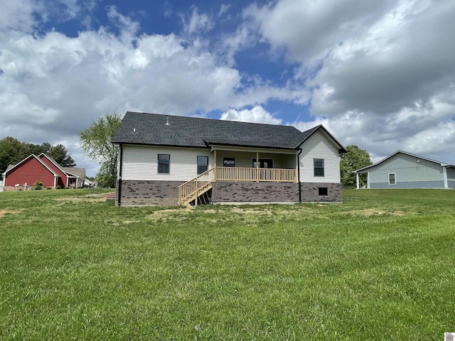 1360 Eagle Ln, Mayfield, KY 42066 - rear view of house with a yard, brick siding, and a shingled roof