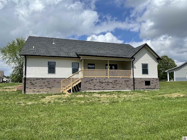 1360 Eagle Ln, Mayfield, KY 42066 - back of house featuring covered porch, a shingled roof, a yard, and brick siding