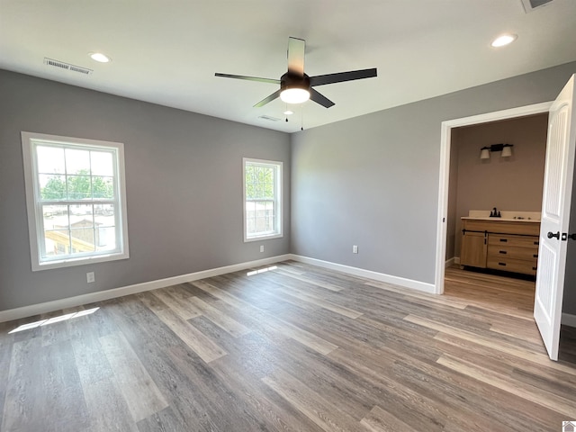 1360 Eagle Ln, Mayfield, KY 42066 - unfurnished bedroom featuring baseboards, recessed lighting, wood finished floors, and visible vents