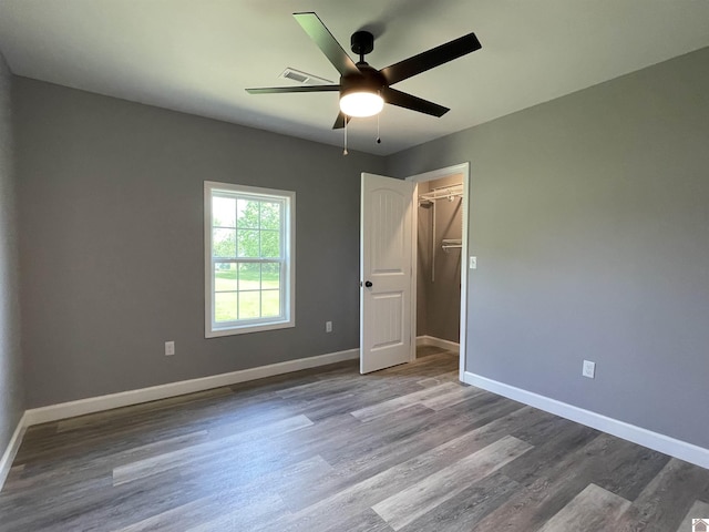 1360 Eagle Ln, Mayfield, KY 42066 - unfurnished bedroom with baseboards, visible vents, wood finished floors, and a closet