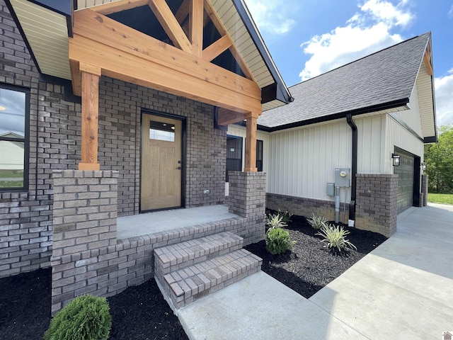 1360 Eagle Ln, Mayfield, KY 42066 - entrance to property with board and batten siding, covered porch, brick siding, an attached garage, and a shingled roof