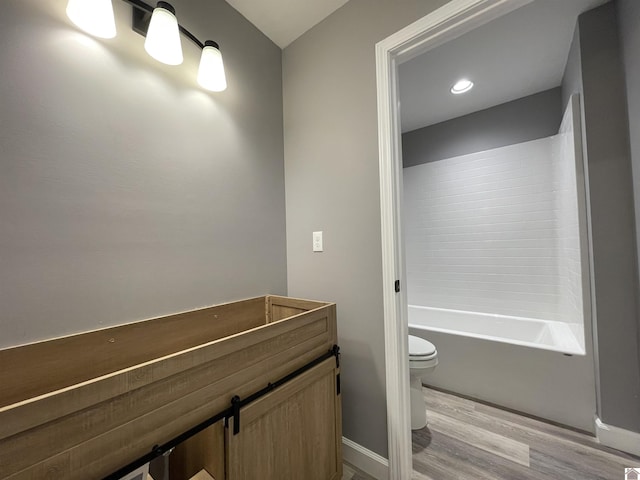 1360 Eagle Ln, Mayfield, KY 42066 - bathroom with baseboards, toilet, and wood finished floors