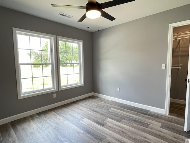 1360 Eagle Ln, Mayfield, KY 42066 - spare room with visible vents, baseboards, ceiling fan, and wood finished floors
