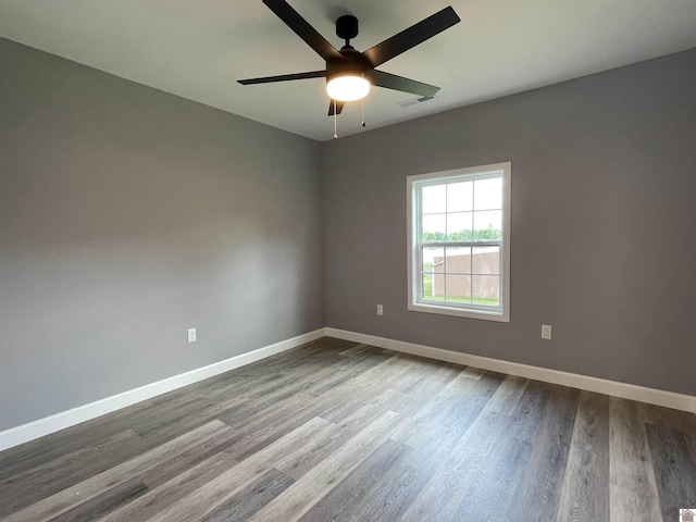 1360 Eagle Ln, Mayfield, KY 42066 - unfurnished room featuring baseboards, ceiling fan, dark wood finished floors, and visible vents