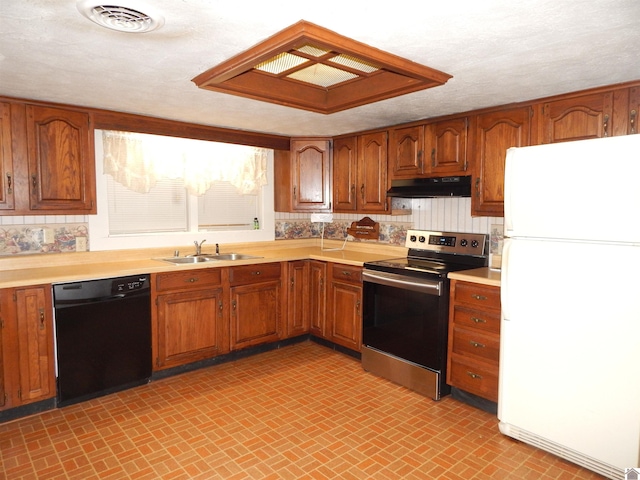 2286 Murray Hwy, Benton, KY 42025 - kitchen with a sink, freestanding refrigerator, under cabinet range hood, stainless steel electric stove, and black dishwasher