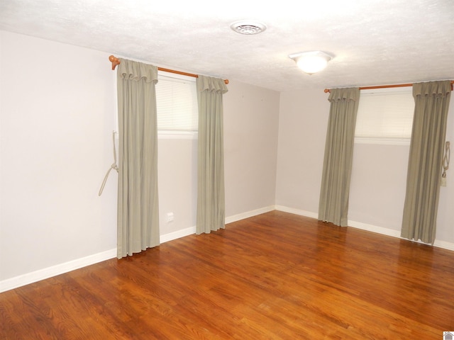 2286 Murray Hwy, Benton, KY 42025 - empty room with baseboards, wood finished floors, and visible vents