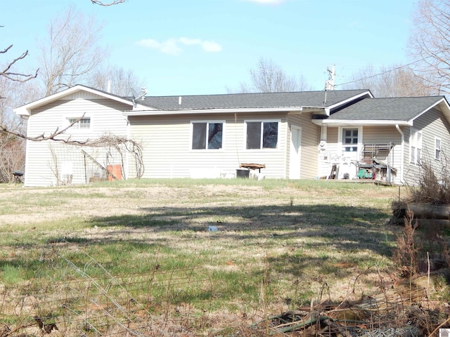 2286 Murray Hwy, Benton, KY 42025 - back of house featuring roof with shingles and a yard