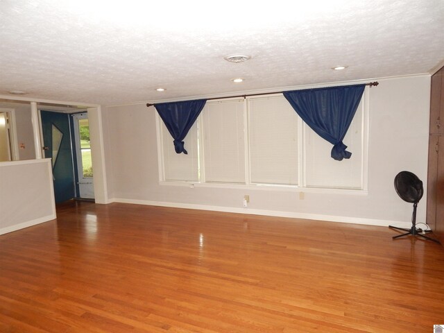 2286 Murray Hwy, Benton, KY 42025 - spare room with baseboards, recessed lighting, a textured ceiling, and light wood finished floors