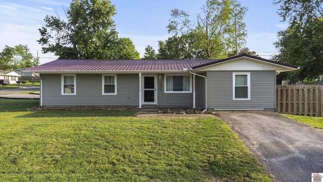 212 Leland Ave, Marion, KY 42064 - ranch-style house with metal roof and asphalt driveway