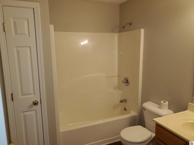 full bath featuring vanity, toilet, and  shower combination