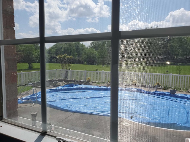 view of swimming pool with fence