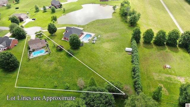 bird's eye view of a nearby body of water and a pool area