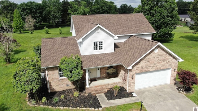 traditional-style home featuring a porch, brick siding, roof with shingles, and a garage