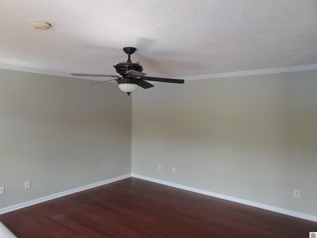 unfurnished room featuring ceiling fan, dark wood-style flooring, baseboards, crown molding, and a textured ceiling