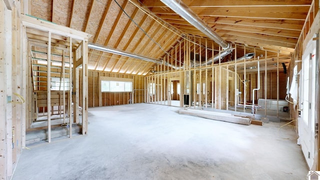 miscellaneous room with lofted ceiling