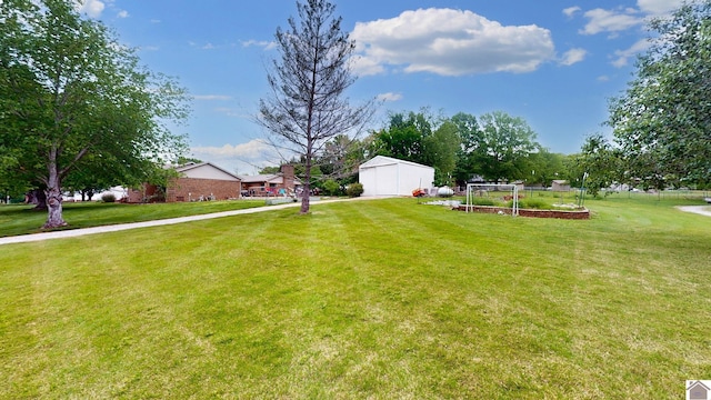 486 Mermie, Hardin, KY 42048 - view of yard featuring an outbuilding and a garden