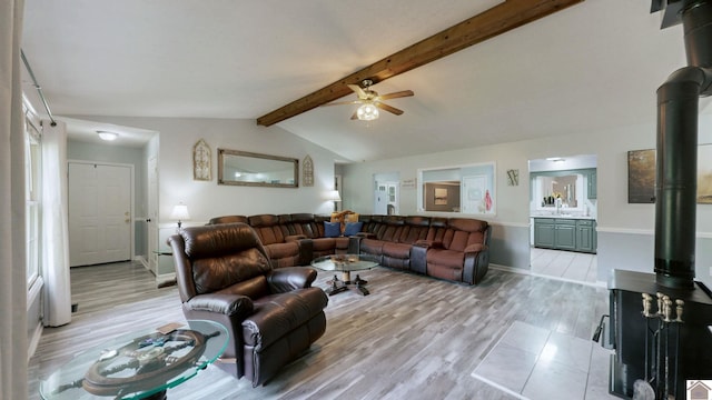 486 Mermie, Hardin, KY 42048 - living area featuring a ceiling fan, baseboards, vaulted ceiling with beams, and light wood finished floors