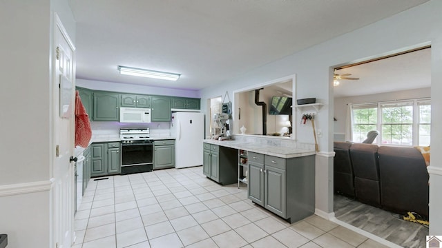 486 Mermie, Hardin, KY 42048 - kitchen featuring light tile patterned flooring, white appliances, ceiling fan, light countertops, and green cabinets