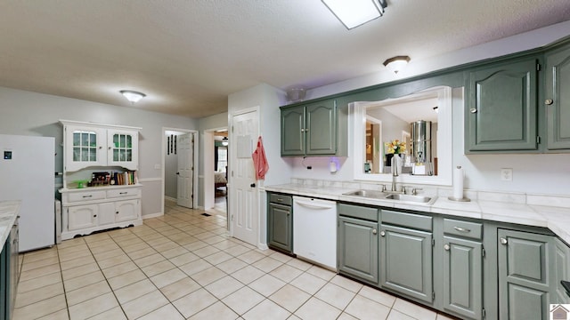 486 Mermie, Hardin, KY 42048 - kitchen with a sink, white appliances, light countertops, a textured ceiling, and light tile patterned floors