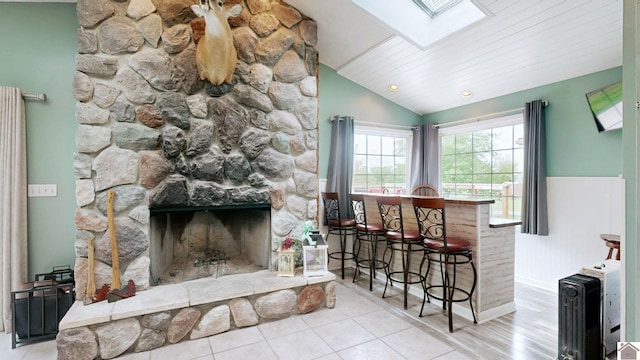486 Mermie, Hardin, KY 42048 - interior space featuring a bar, a stone fireplace, and lofted ceiling