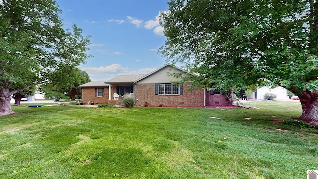 486 Mermie, Hardin, KY 42048 - view of front facade featuring a front yard, brick siding, and crawl space