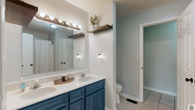 486 Mermie, Hardin, KY 42048 - full bath with double vanity, toilet, a sink, and tile patterned flooring