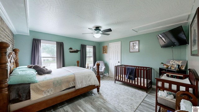 486 Mermie, Hardin, KY 42048 - bedroom with light wood-style floors, attic access, baseboards, ceiling fan, and a textured ceiling