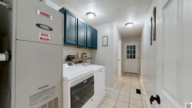 486 Mermie, Hardin, KY 42048 - laundry area featuring a textured ceiling, independent washer and dryer, cabinet space, light tile patterned floors, and heating unit