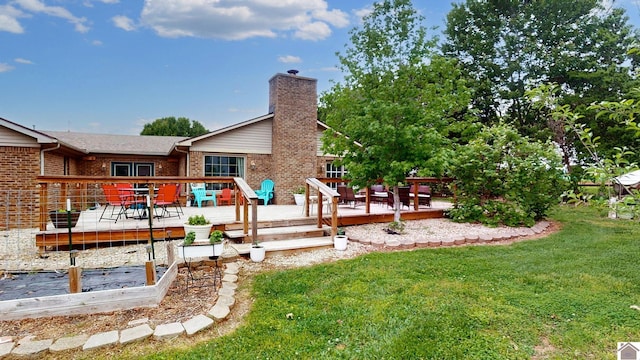486 Mermie, Hardin, KY 42048 - rear view of property with a yard, brick siding, a chimney, and a deck