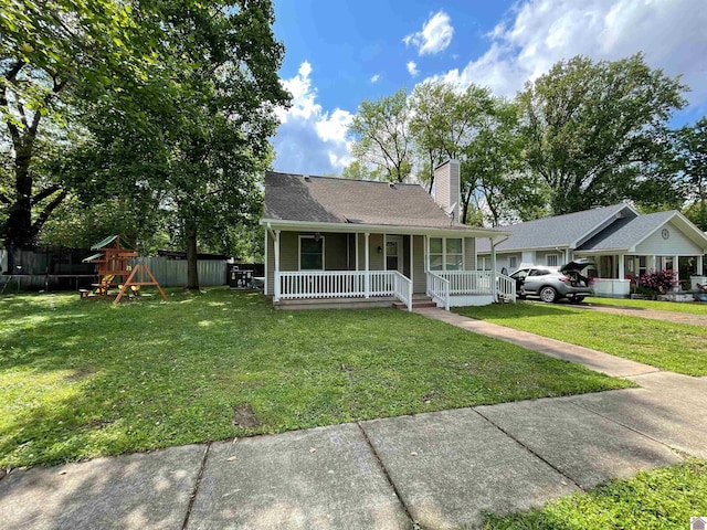 429 S 2nd St, Mayfield, KY 42066 - bungalow-style home with a porch, a playground, a chimney, and a front yard