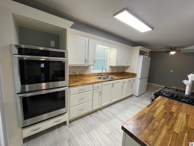 429 S 2nd St, Mayfield, KY 42066 - kitchen featuring freestanding refrigerator, butcher block countertops, gas range oven, a sink, and double oven