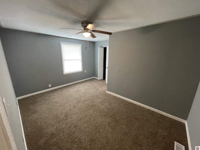 429 S 2nd St, Mayfield, KY 42066 - carpeted spare room with ceiling fan, a textured ceiling, baseboards, and visible vents