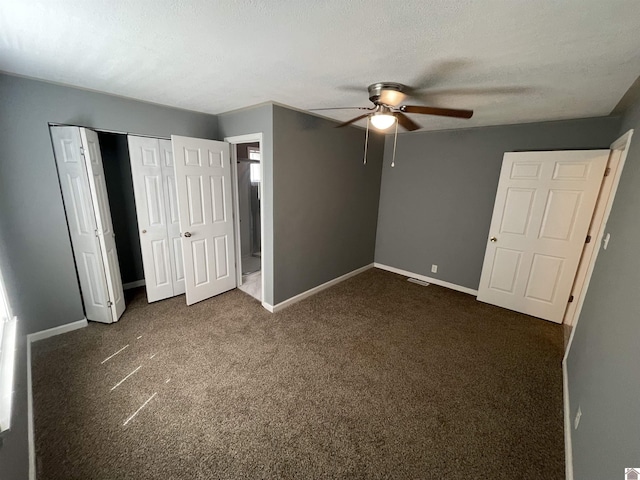 429 S 2nd St, Mayfield, KY 42066 - unfurnished bedroom with a closet, visible vents, dark colored carpet, a ceiling fan, and baseboards