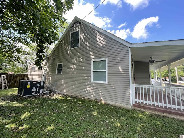 429 S 2nd St, Mayfield, KY 42066 - view of side of home with a yard, fence, and a ceiling fan