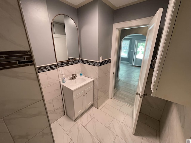 429 S 2nd St, Mayfield, KY 42066 - bathroom with tile walls, a wainscoted wall, marble finish floor, and vanity