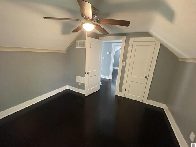 429 S 2nd St, Mayfield, KY 42066 - bonus room with baseboards, dark wood finished floors, ceiling fan, visible vents, and vaulted ceiling
