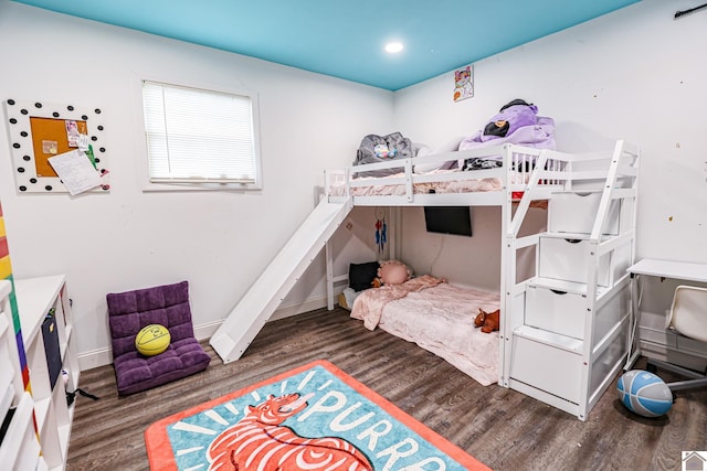 bedroom with baseboards, recessed lighting, and wood finished floors
