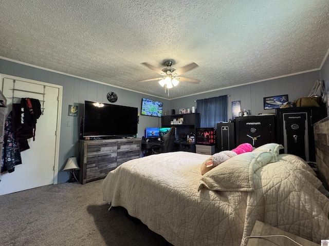 bedroom featuring a textured ceiling, crown molding, and carpet
